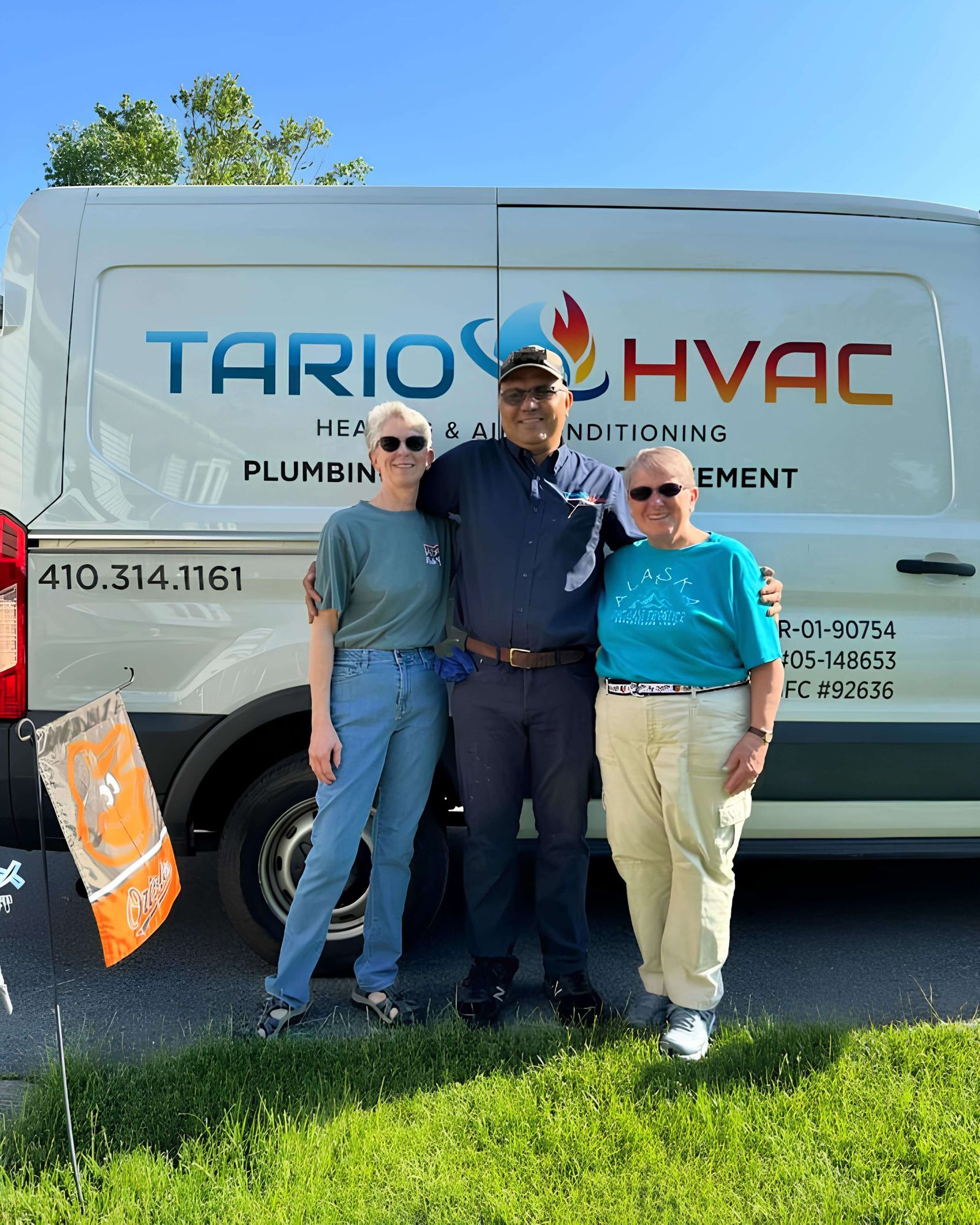 Tario HVAC technicians unloading equipment from the company van