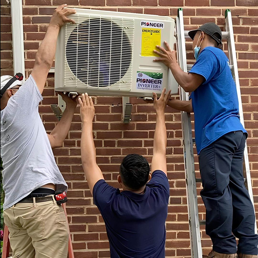 Tario HVAC technician servicing an outdoor AC condenser